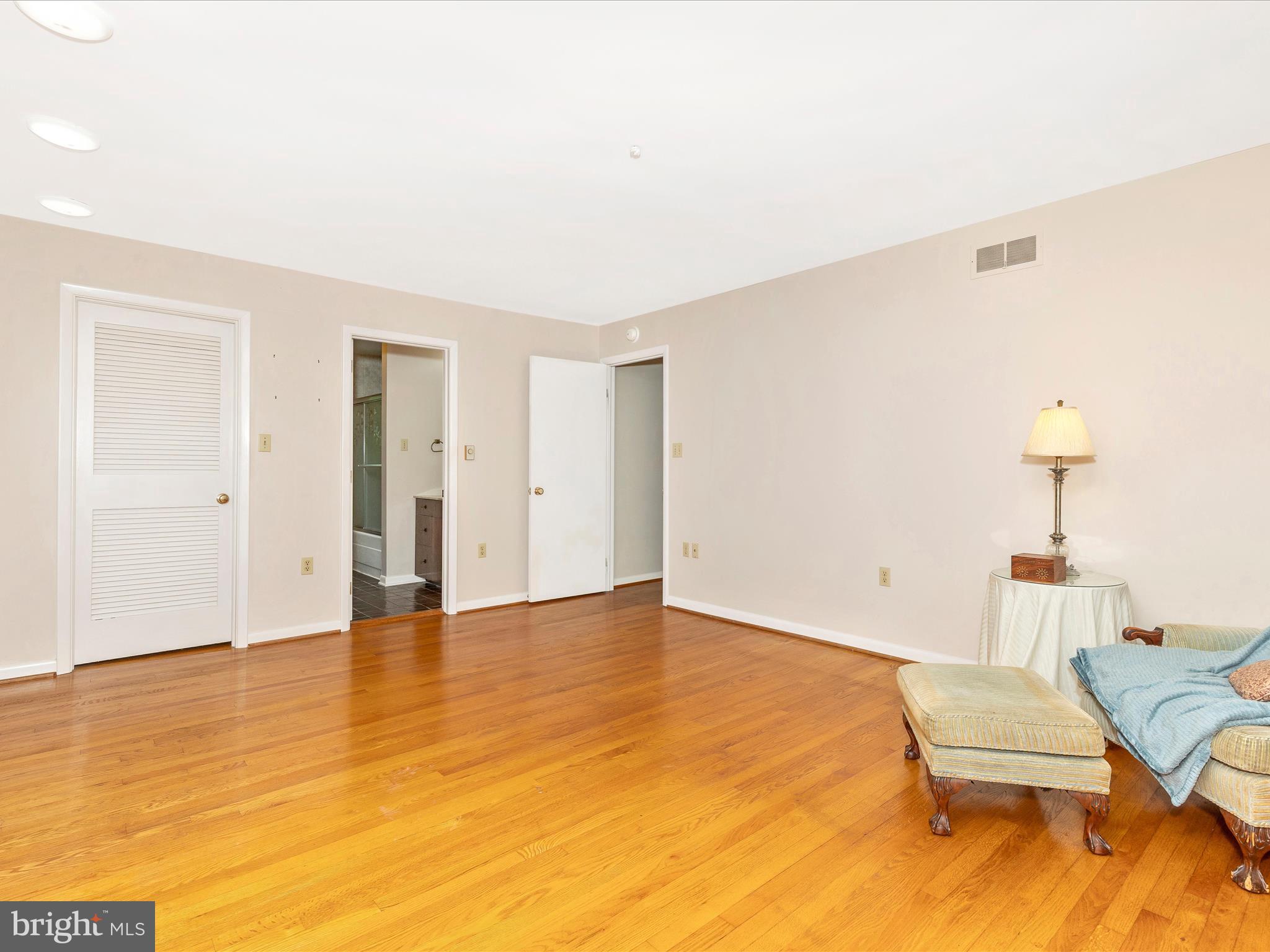 7903 Runnymeade Drive Frederick, MD 21702 - Photo 28 of 51 a view of an empty room with furniture and wooden floor