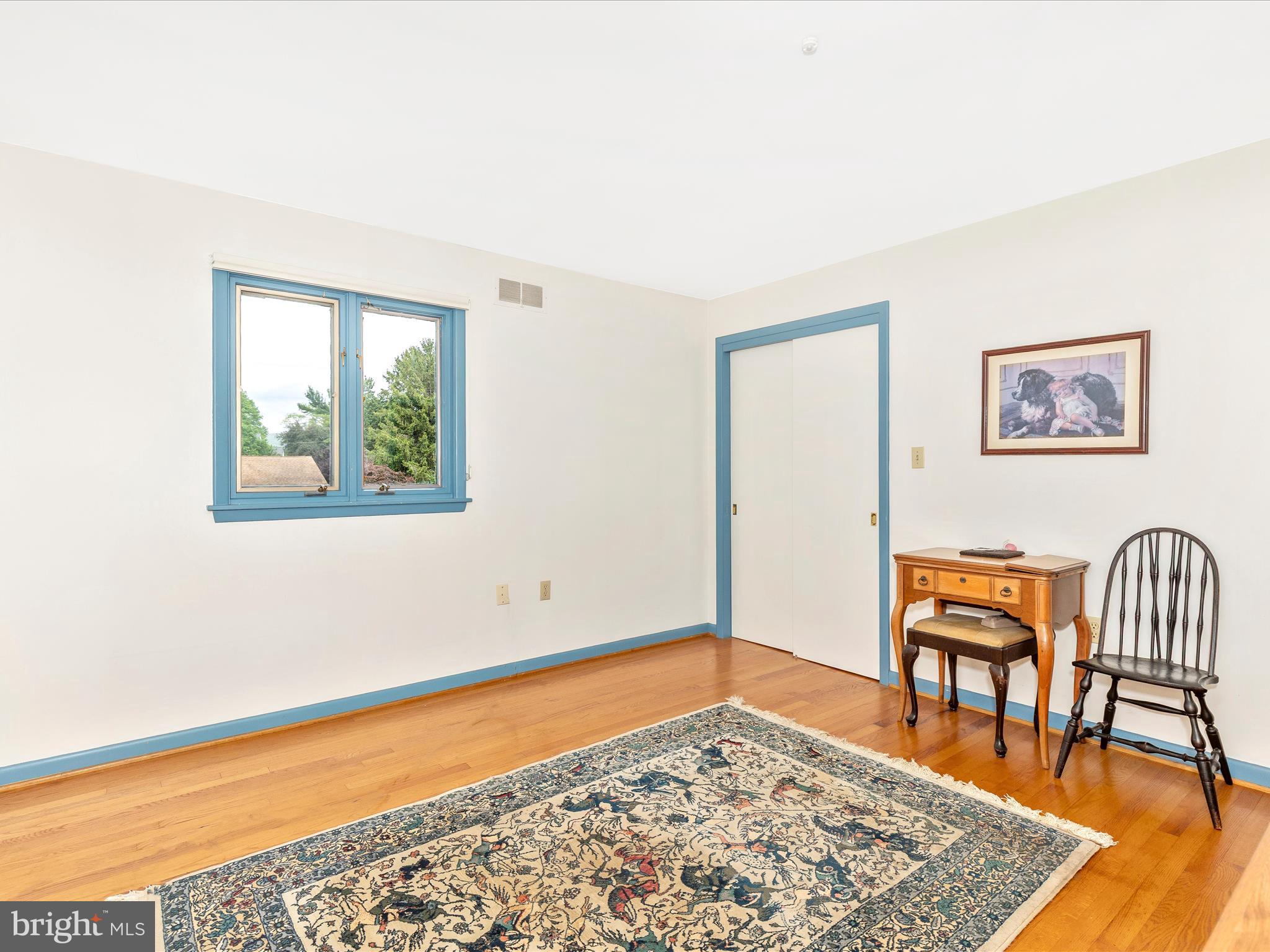 7903 Runnymeade Drive Frederick, MD 21702 - Photo 32 of 51 a living room with furniture and a rug