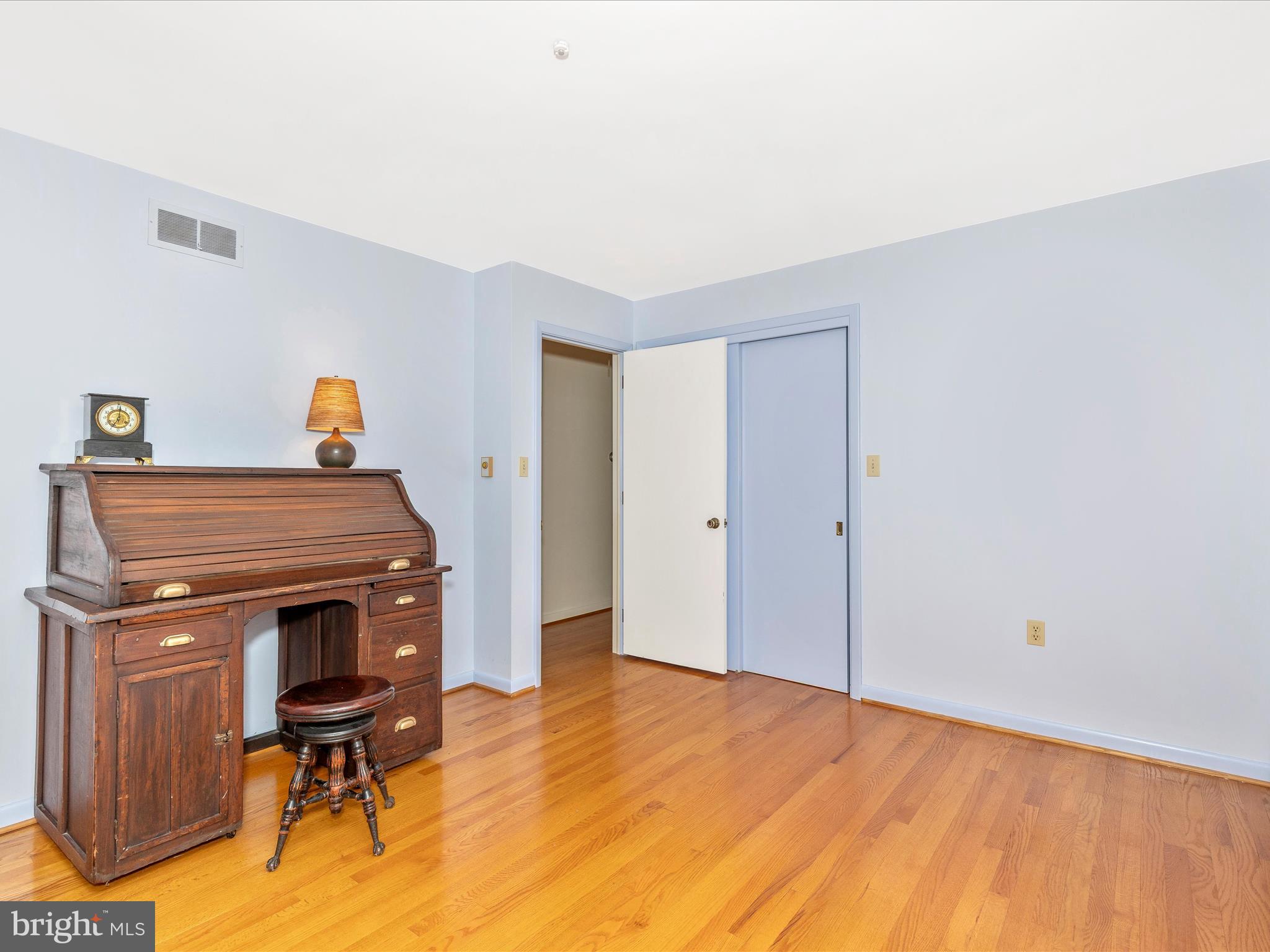 7903 Runnymeade Drive Frederick, MD 21702 - Photo 35 of 51 a view of a workspace with furniture and wooden floor