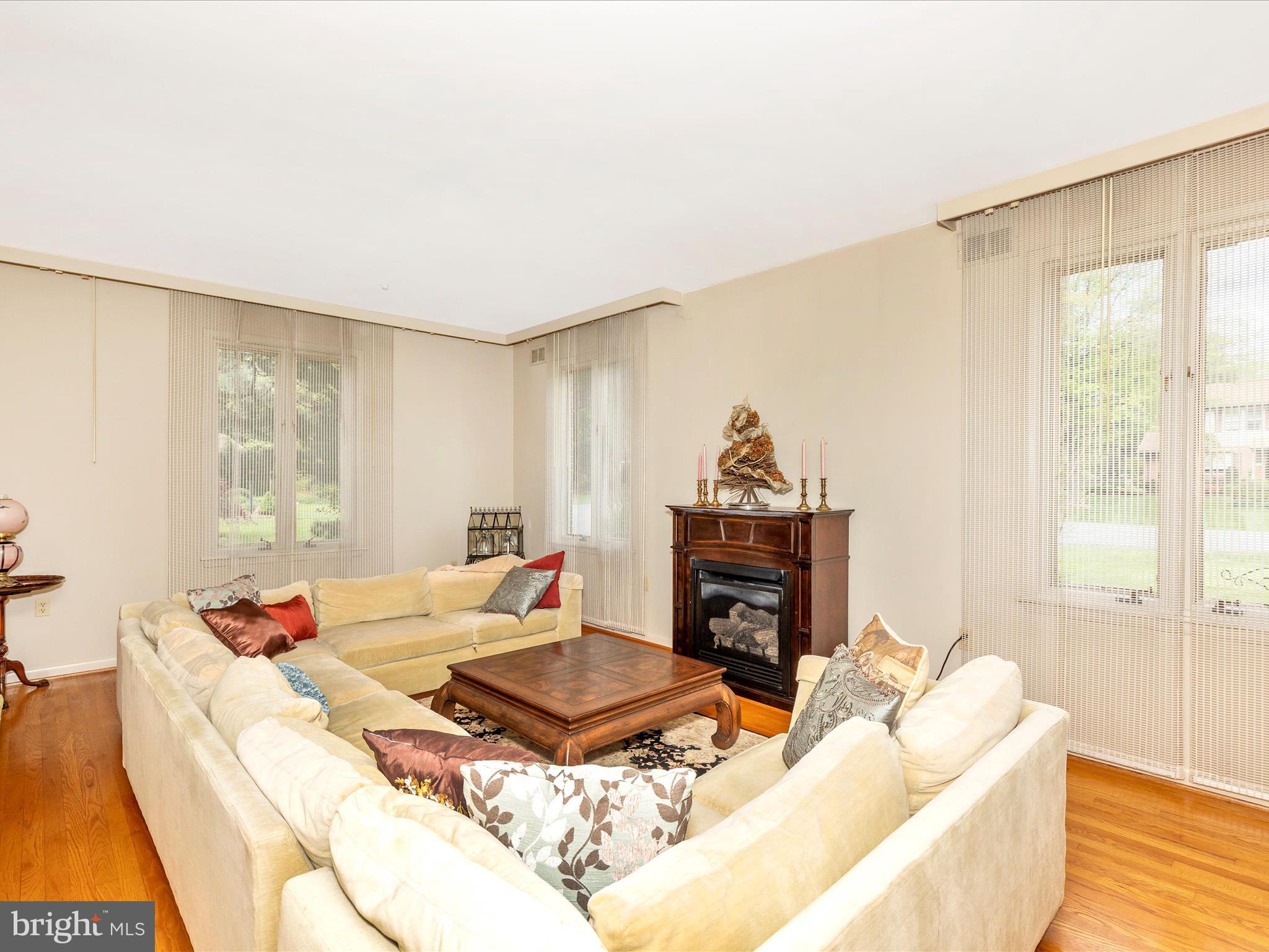 7903 Runnymeade Drive Frederick, MD 21702 - Photo 6 of 51 a living room with furniture and a fireplace