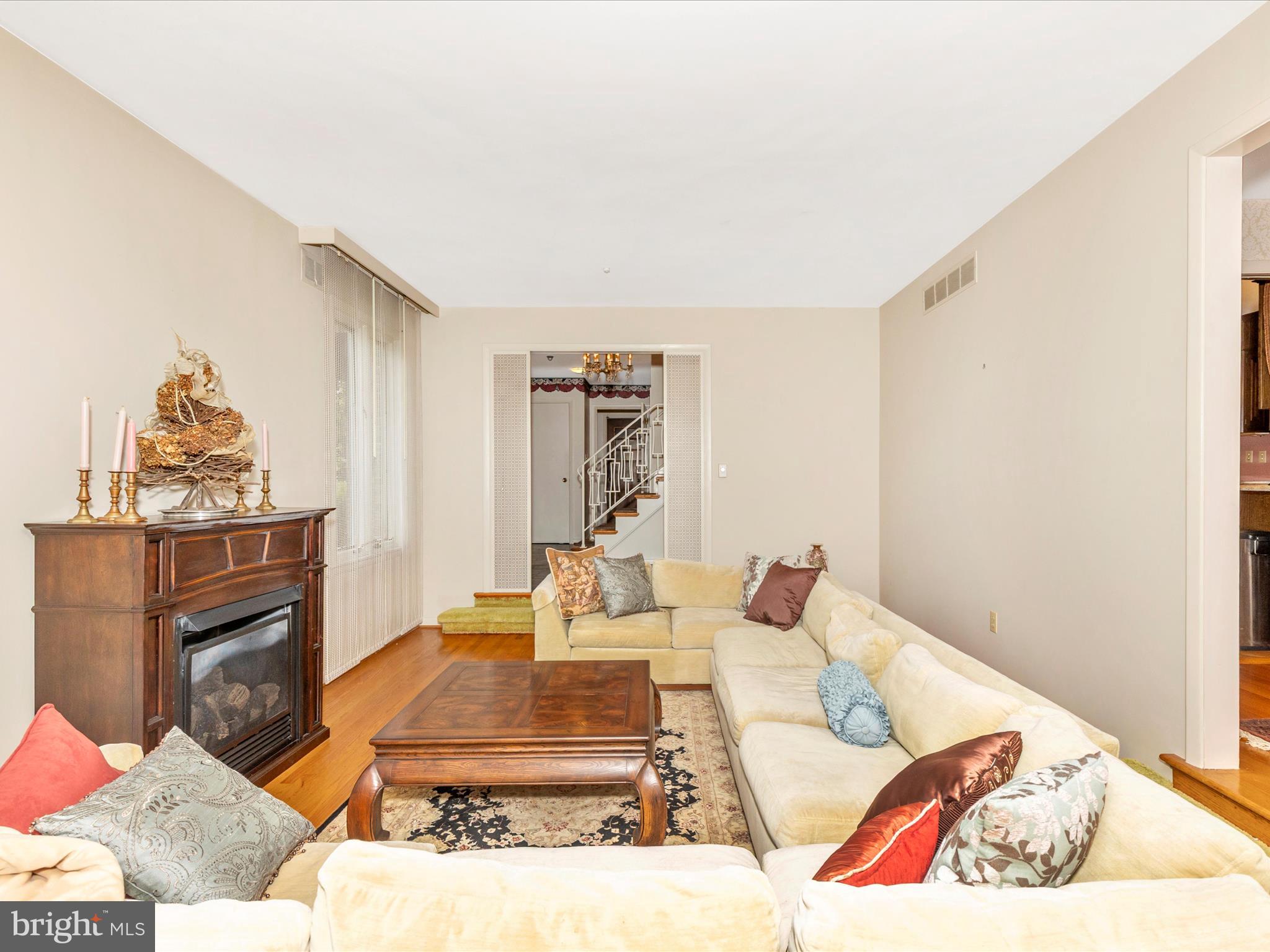 7903 Runnymeade Drive Frederick, MD 21702 - Photo 7 of 51 a living room with furniture flowerpot and a fireplace