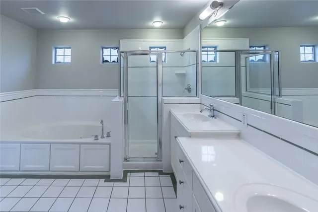 a bathroom with a bathtub and a sink