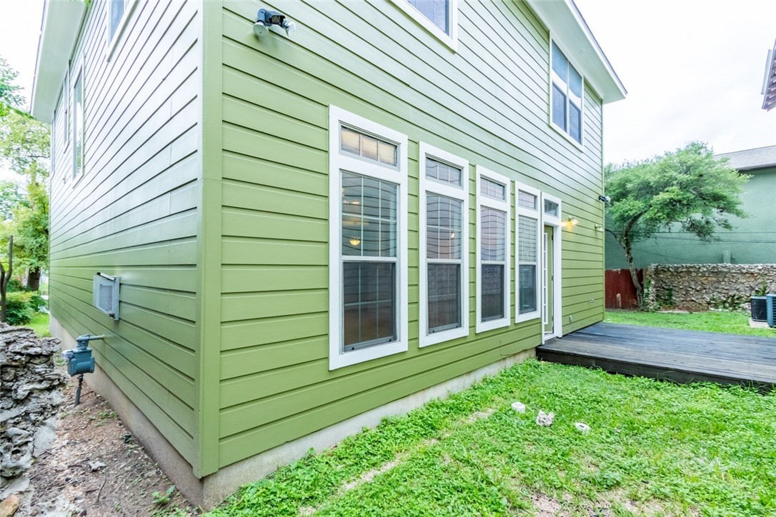 306 East 34th Street, Unit A Austin, TX 78705 - Photo 22 of 28 a view of a backyard with plants and large trees