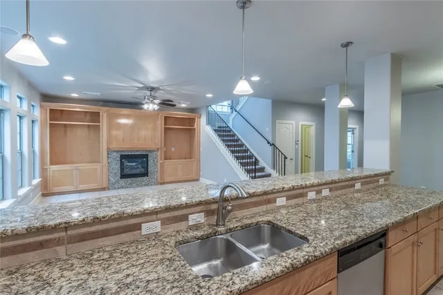 a room with lots of windows and a rug