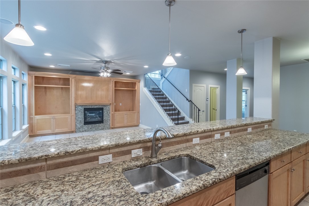 306 East 34th Street, Unit A Austin, TX 78705 - Photo 26 of 28 a kitchen with a sink a faucet and stainless steel appliances