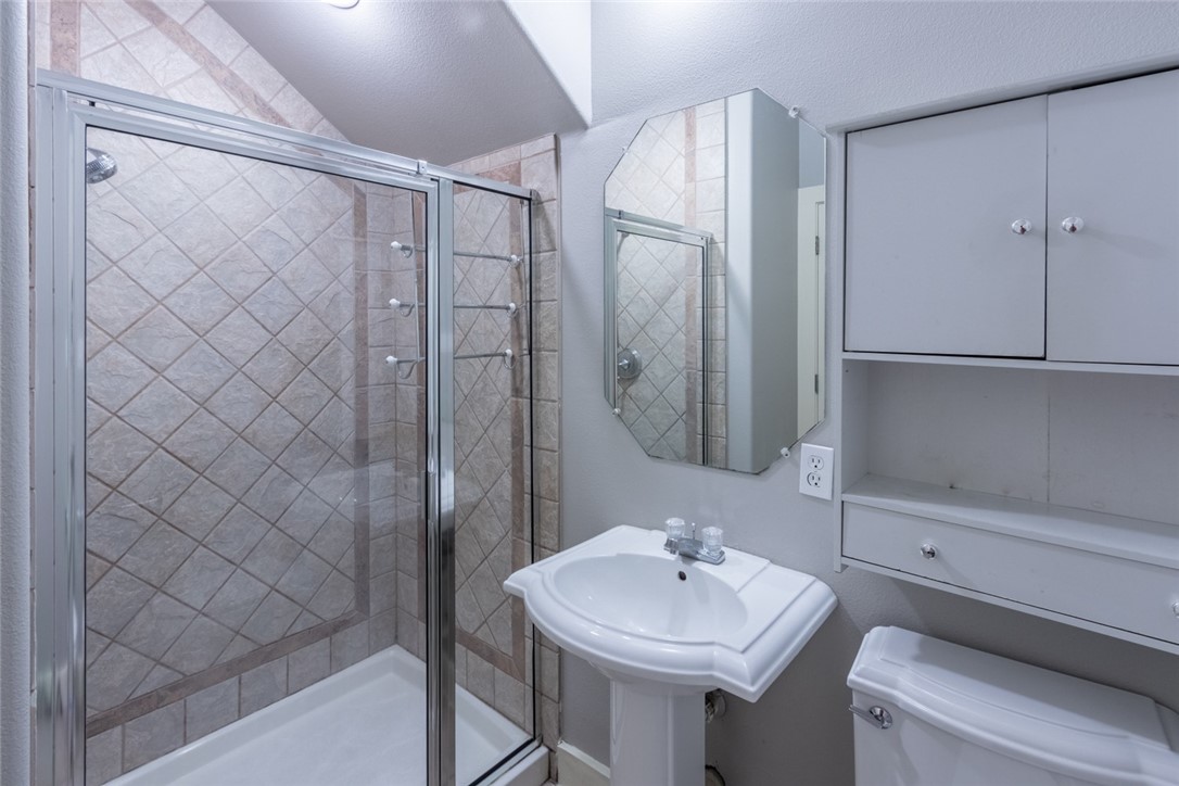 306 East 34th Street, Unit A Austin, TX 78705 - Photo 6 of 28 a bathroom with a sink and mirror
