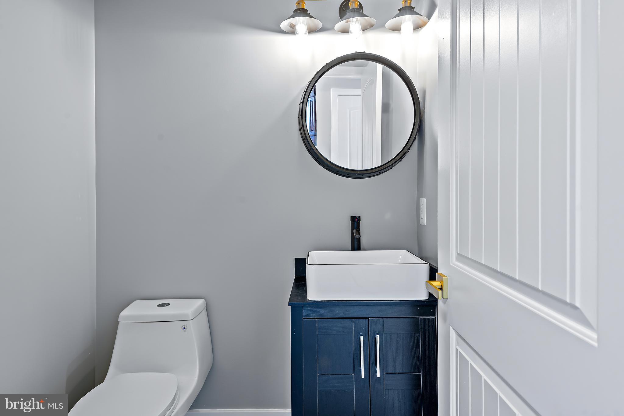 1220 Daves Road Edgewater, MD 21037 - Photo 35 of 79 main floor half bath w oak barrel mirror