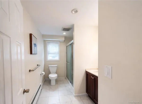 a bathroom with a toilet and a sink