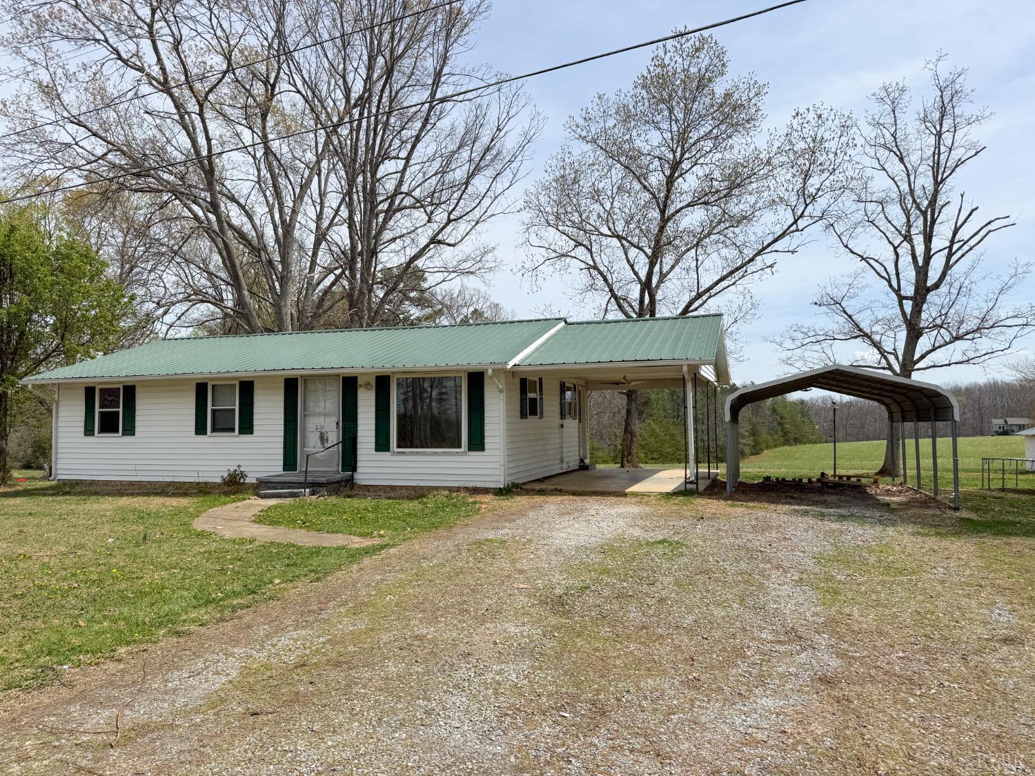a house that has a tree in front of it
