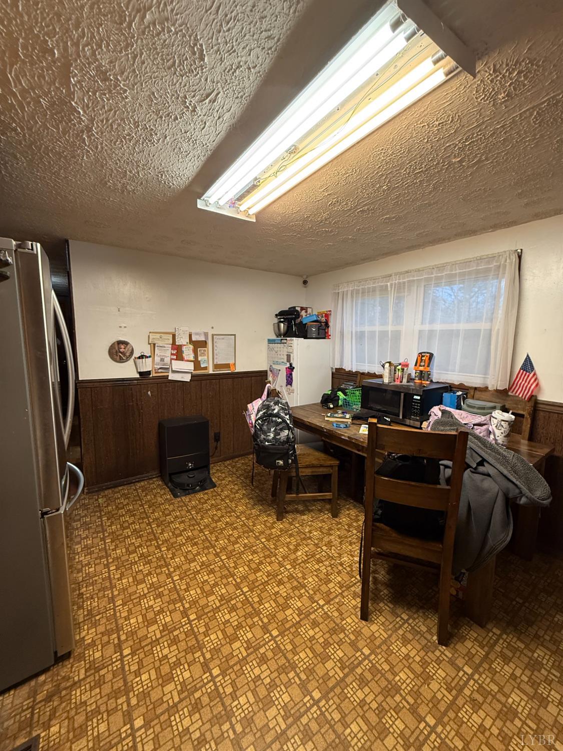 6218 Old Evergreen Road Appomattox, VA 24522 - Photo 2 of 17 a living room with furniture a air conditioner vent and a window