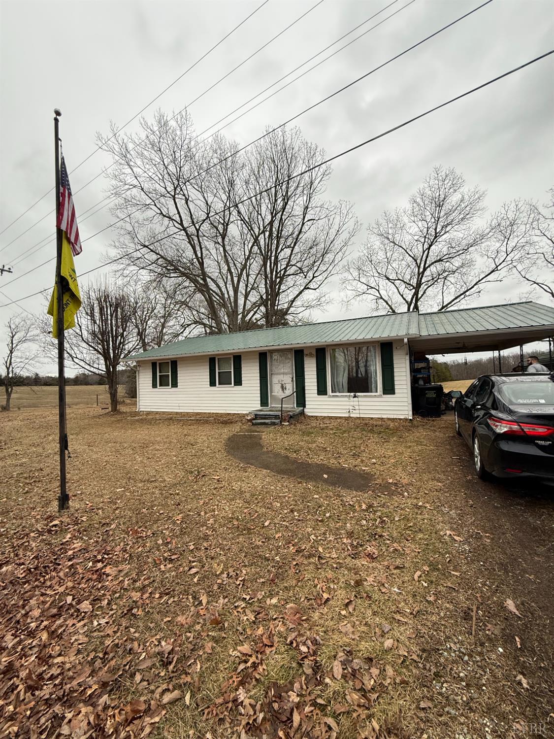 6218 Old Evergreen Road Appomattox, VA 24522 - Photo 4 of 17 a front view of a house with a yard