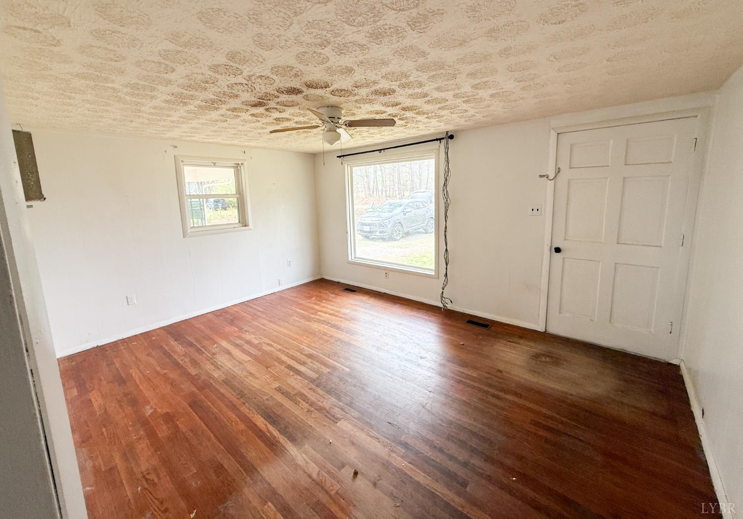 6218 Old Evergreen Road Appomattox, VA 24522 - Photo 4 of 11 wooden floor in an empty room with a window