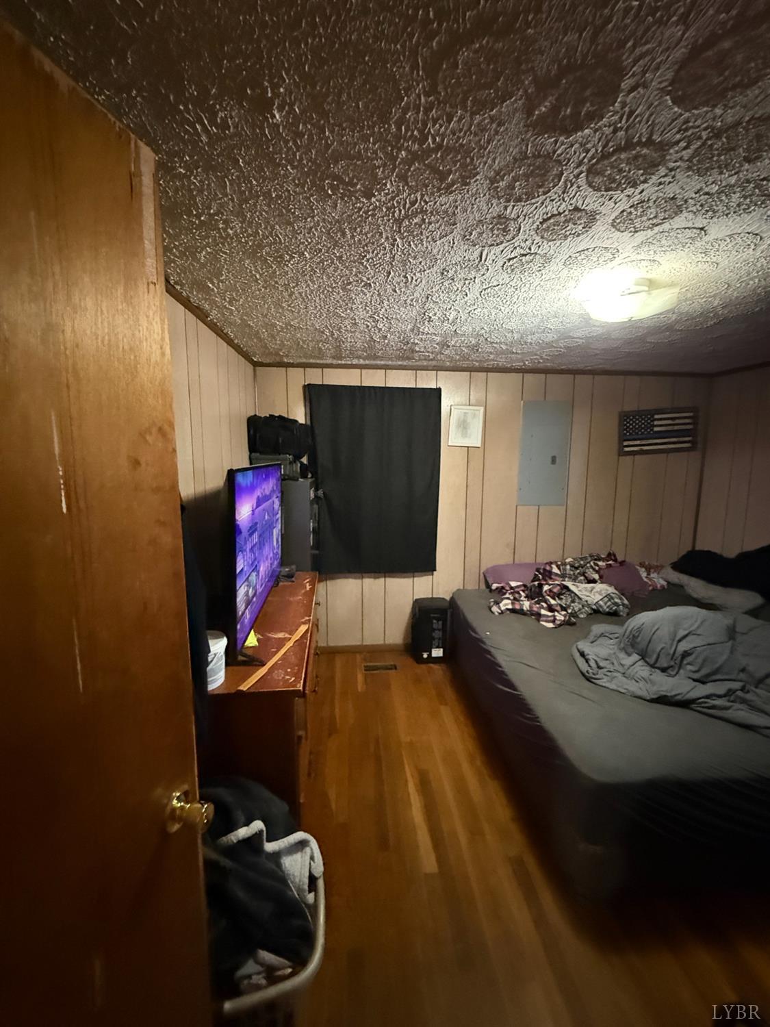 6218 Old Evergreen Road Appomattox, VA 24522 - Photo 9 of 17 a bed room with a bed and a couch