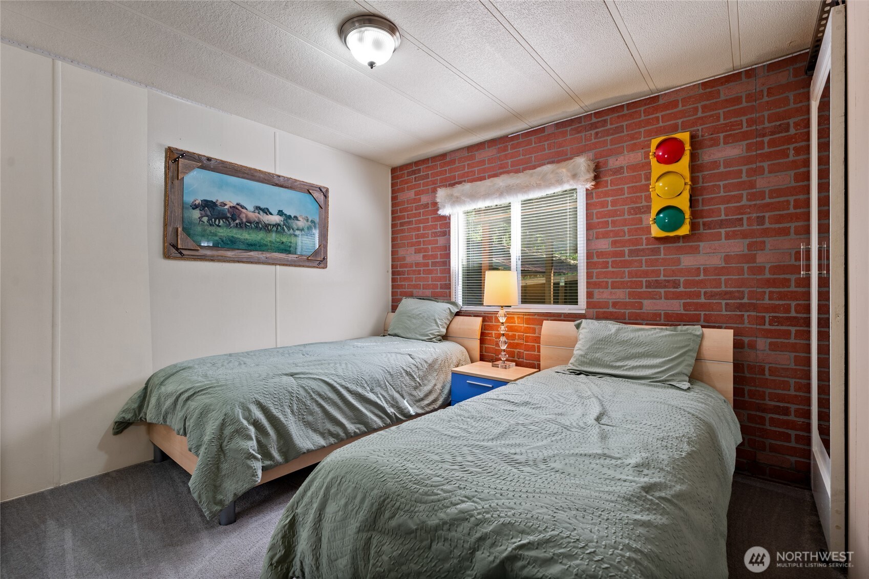 271 Skate Creek Road North Ashford, WA 98304 - Photo 17 of 40 a bedroom with two beds and a window