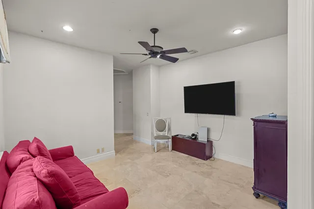 a bathroom with a granite countertop sink toilet a mirror and shower