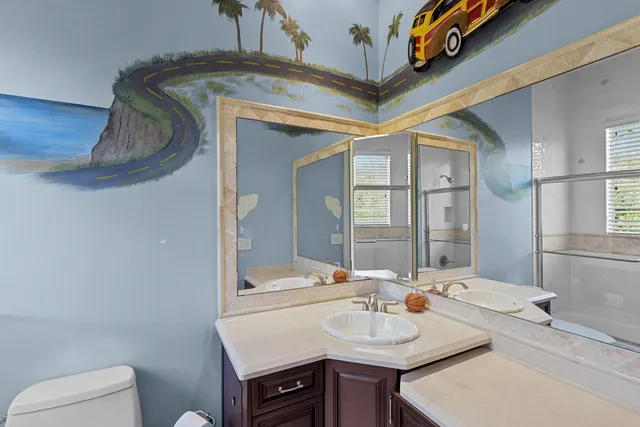 a bedroom with a bed and cabinets