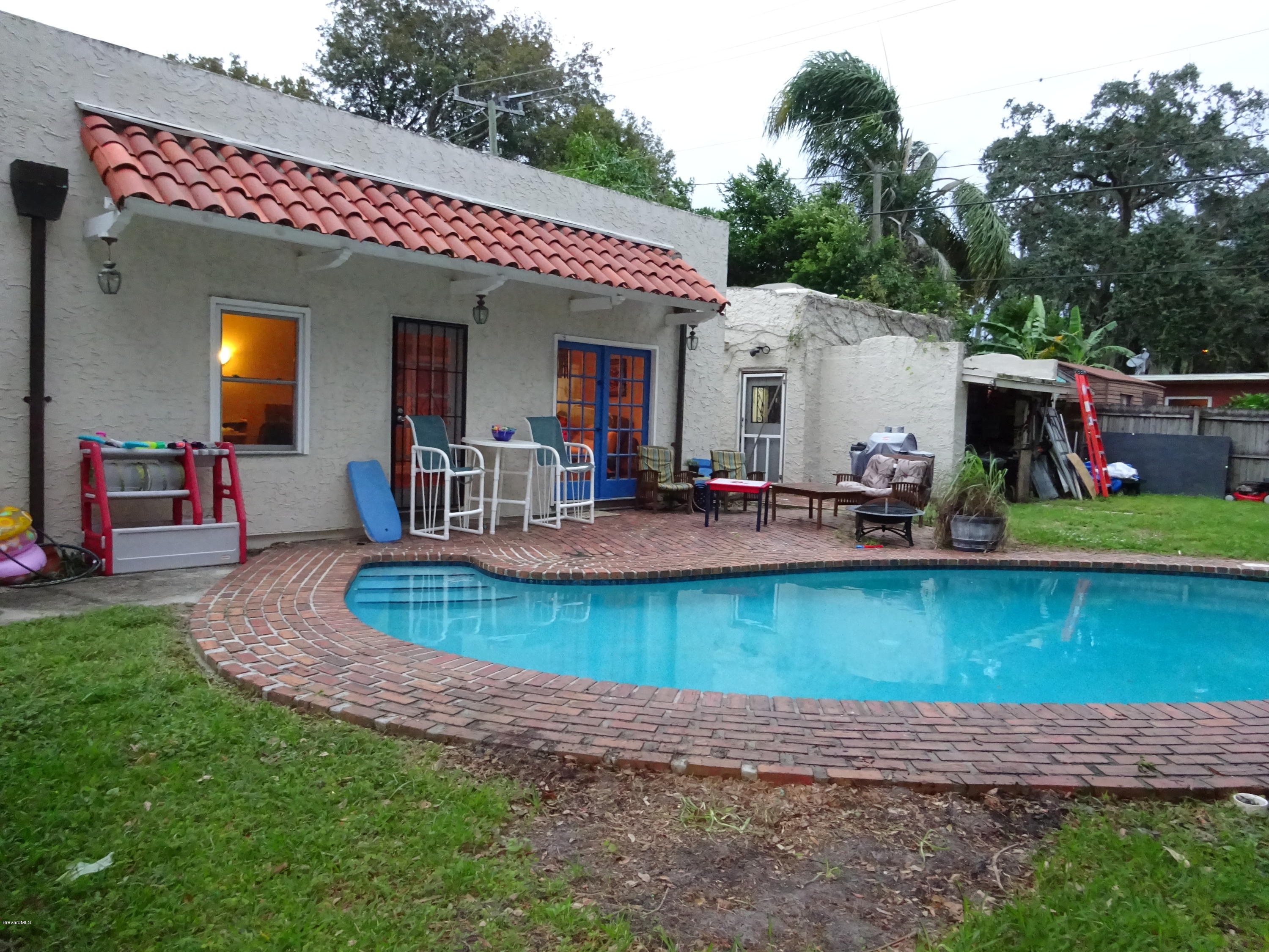 48 Valencia Road Rockledge, FL 32955 - Photo 3 of 21 yard/ pool/ outbuilding