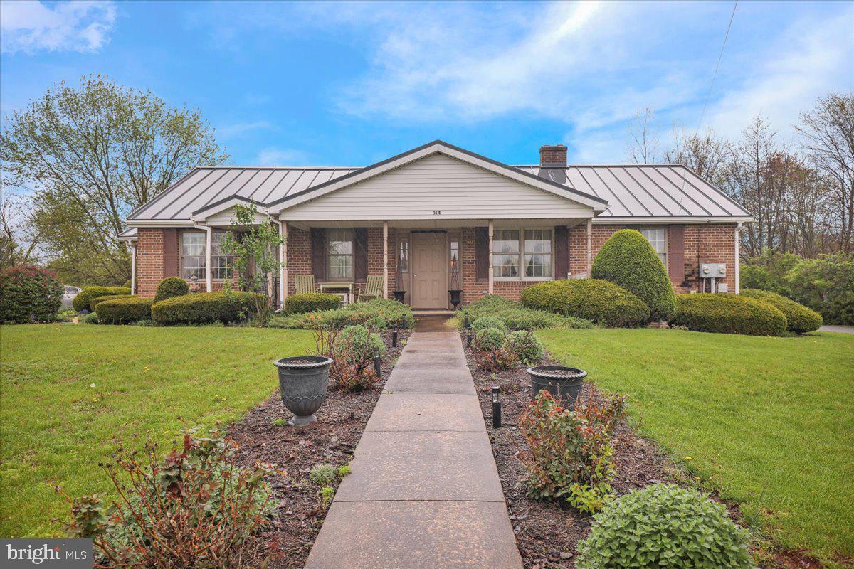 154 West Maple Grove Road Denver, PA 17517 - Photo 2 of 59 a view of a front of house with a yard
