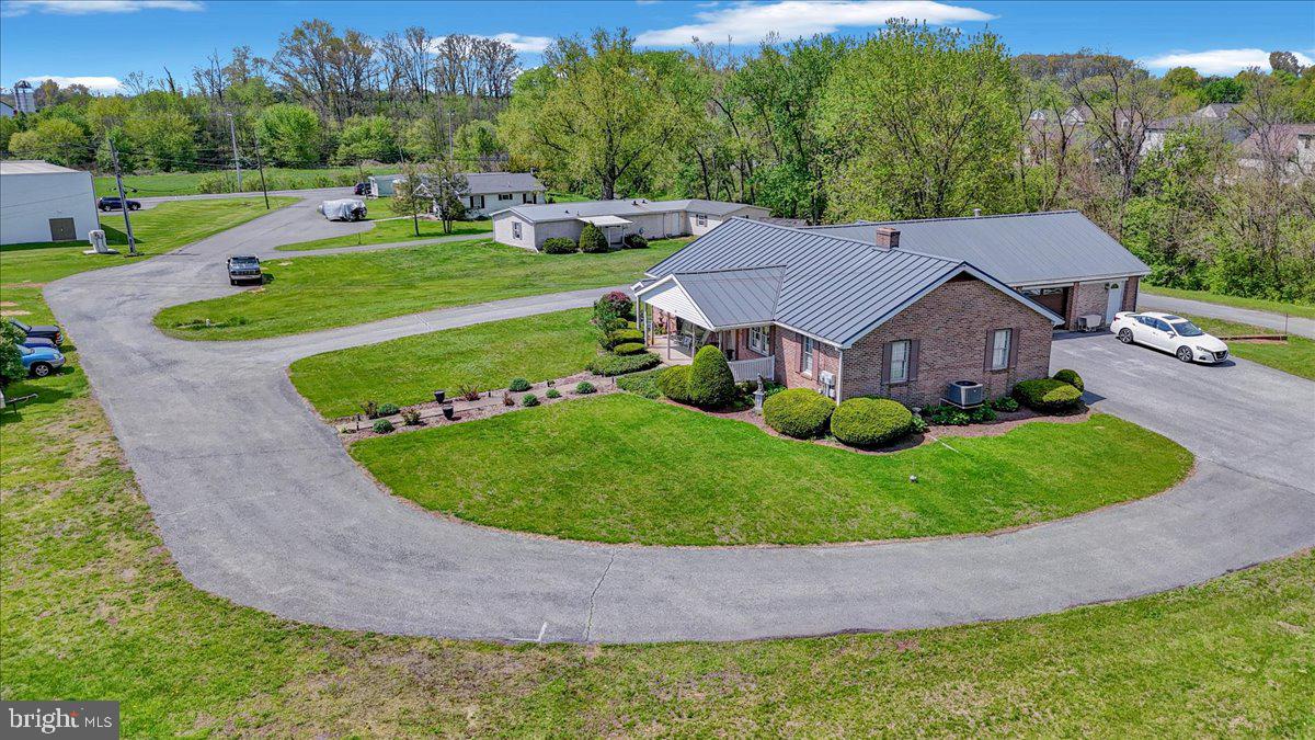 154 West Maple Grove Road Denver, PA 17517 - Photo 23 of 59 aerial view of a house with a garden and trees