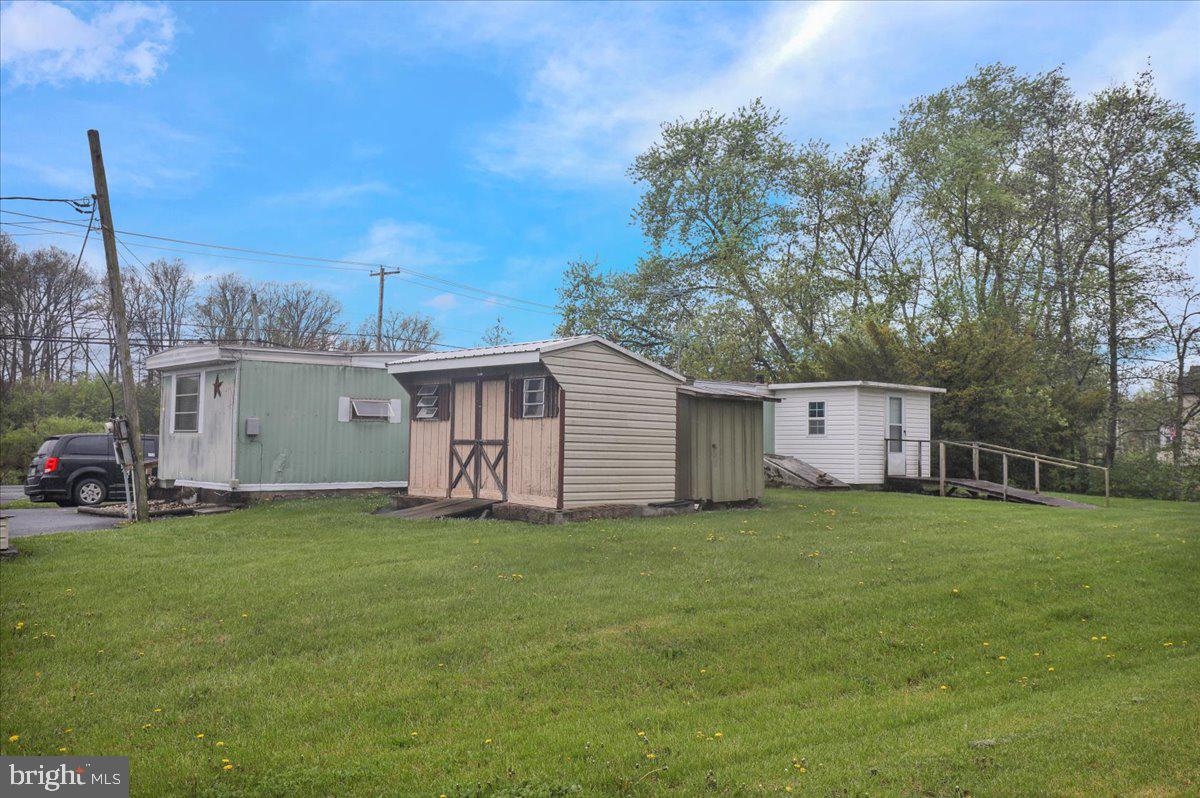 154 West Maple Grove Road Denver, PA 17517 - Photo 37 of 59 a view of a house with a yard and sitting area