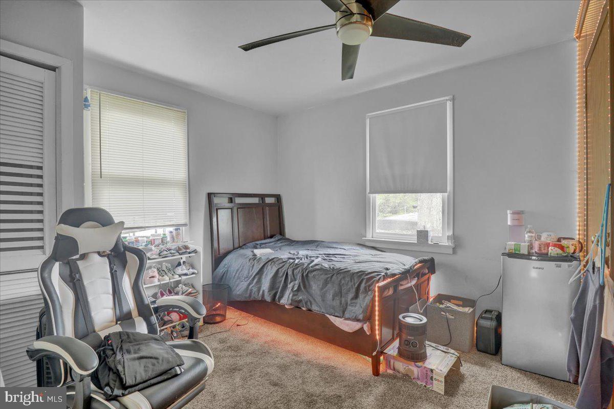 154 West Maple Grove Road Denver, PA 17517 - Photo 43 of 59 a bedroom with bed and a chandelier