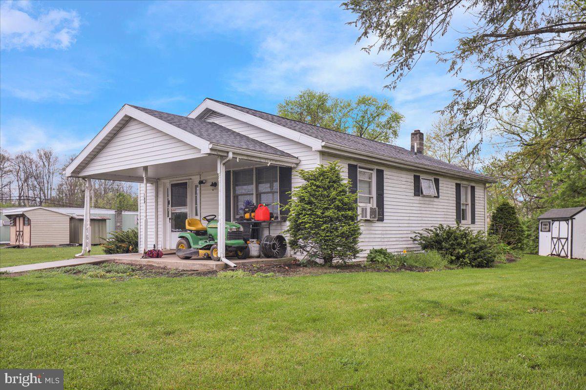154 West Maple Grove Road Denver, PA 17517 - Photo 45 of 59 a front view of house with yard and outdoor seating