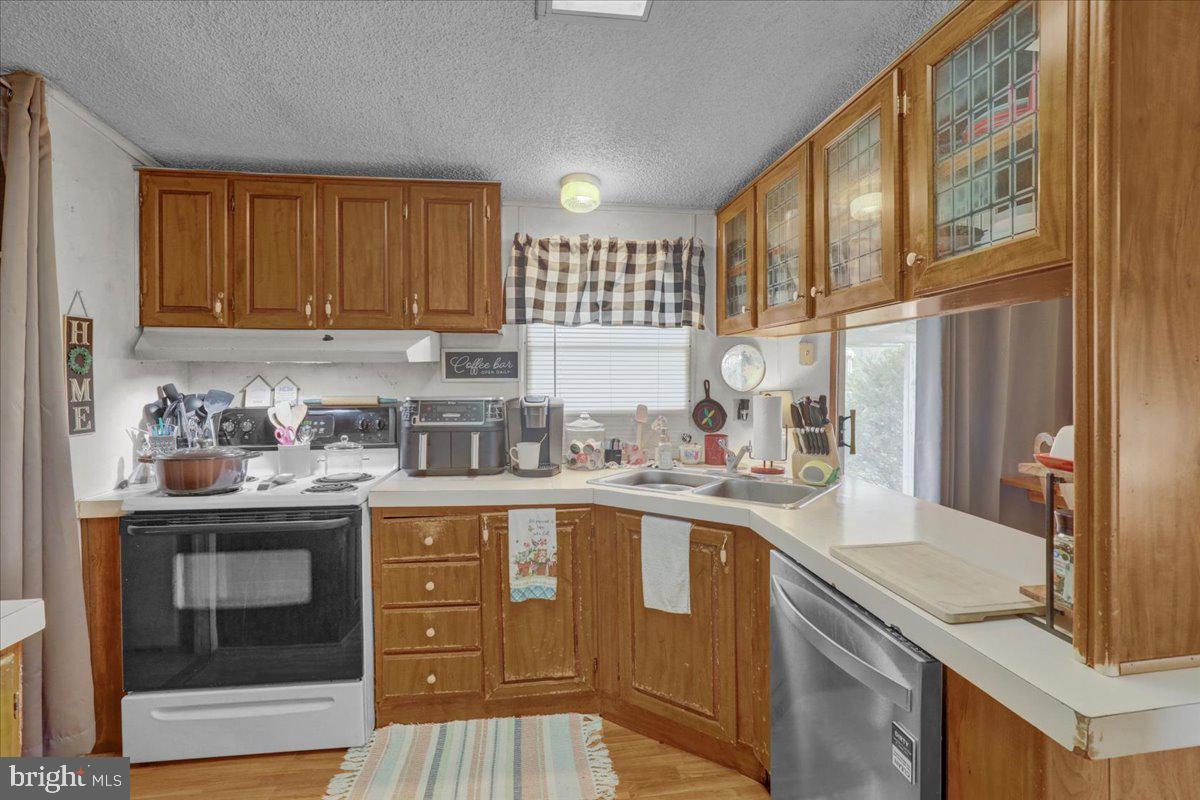 154 West Maple Grove Road Denver, PA 17517 - Photo 50 of 59 a kitchen with a sink stove and cabinets