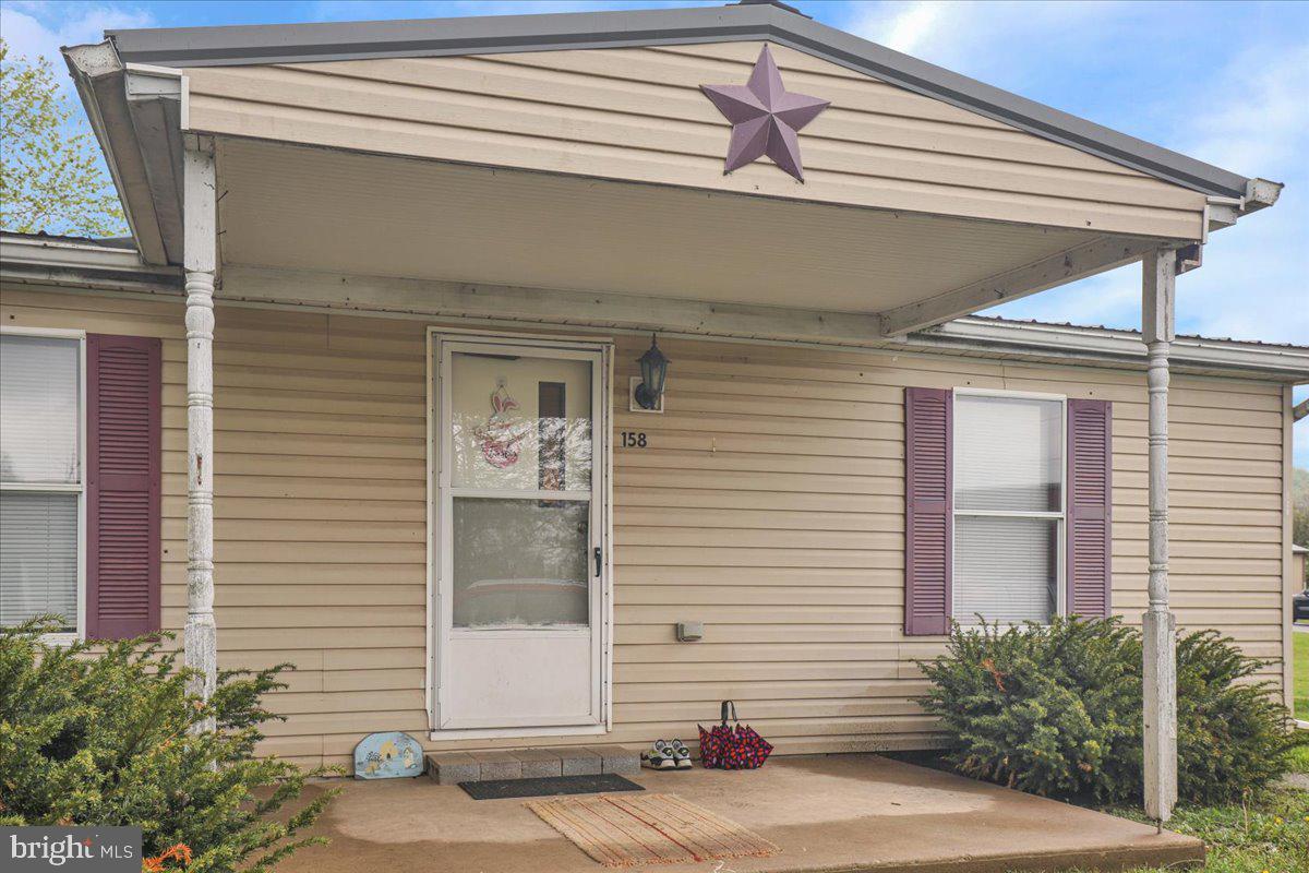 154 West Maple Grove Road Denver, PA 17517 - Photo 53 of 59 a view of a house with a window and potted plants