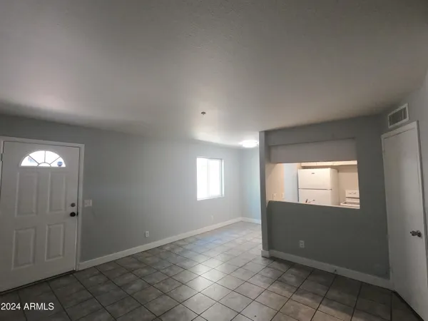 a view of an empty room and window