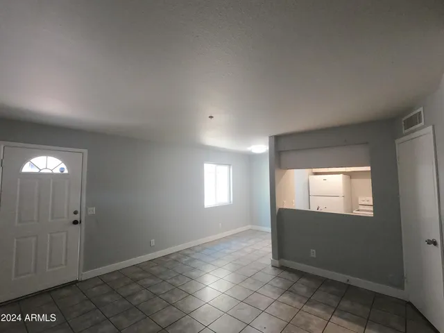 a view of an empty room and window