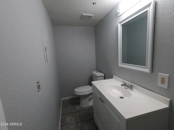 a bathroom with a sink and mirror