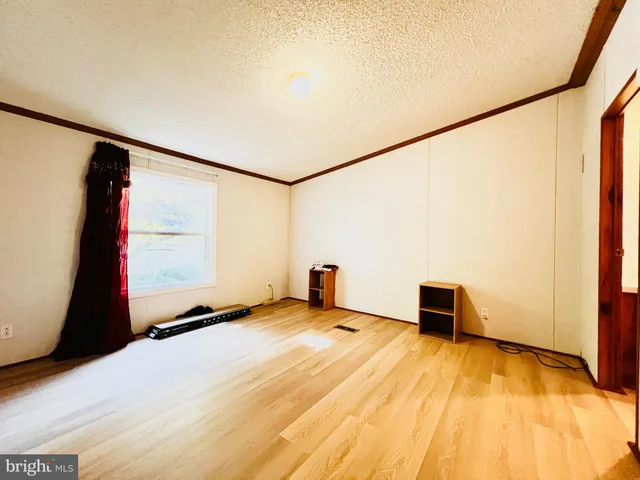 a bed room with a bed and a night stand