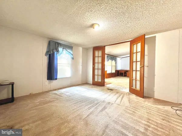 a view of an empty room and window