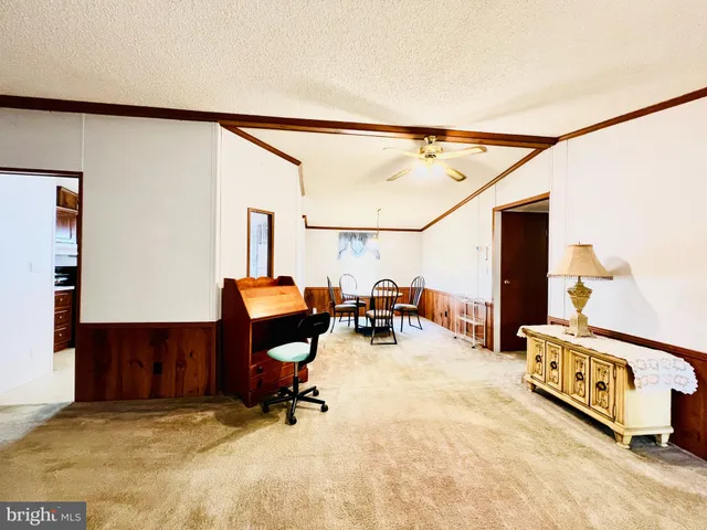 a view of a livingroom with furniture and a rug