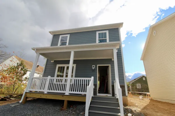 a view of a house with a yard