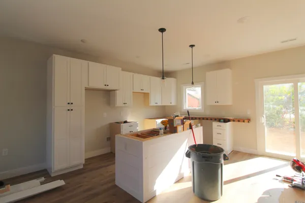 a kitchen with a refrigerator and stove