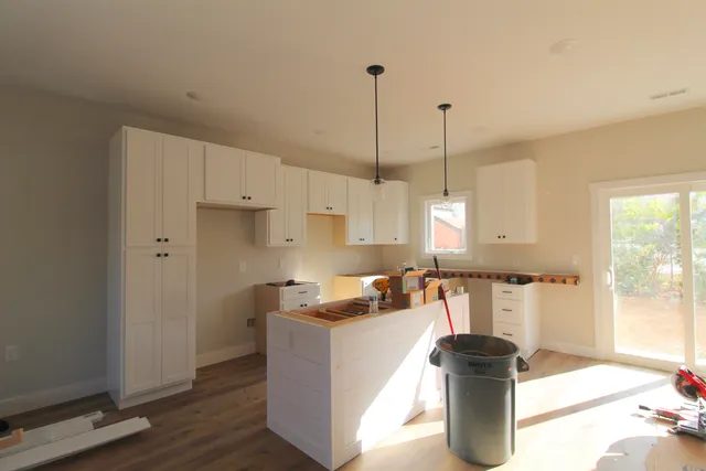 a kitchen with a refrigerator and stove