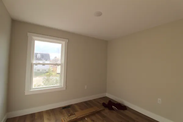 a room with window and wooden floor