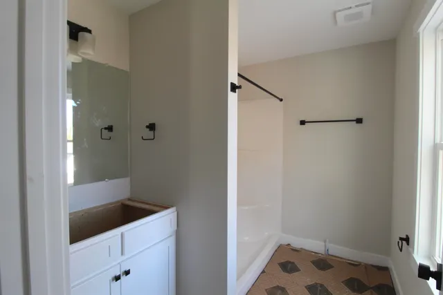 a bathroom with a sink and a shower