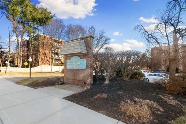 64 Main Street, Unit 53B Stoneham, MA 02180 - Photo 1 of 36 a view of a street with a building in the background