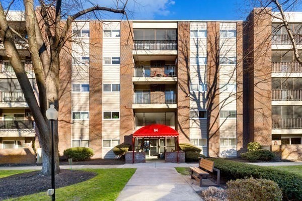 64 Main Street, Unit 53B Stoneham, MA 02180 - Photo 2 of 36 a view of a building with a yard
