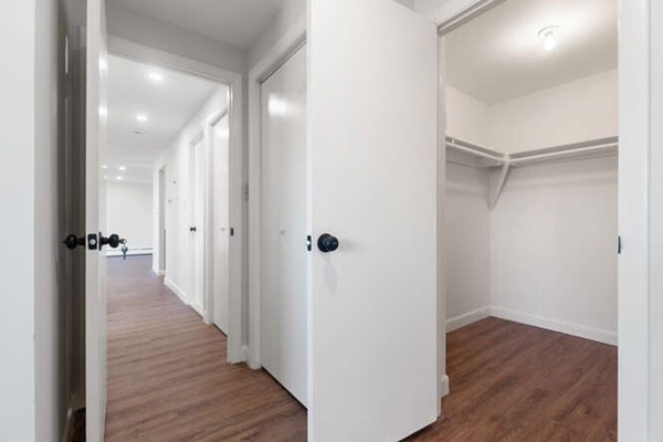 64 Main Street, Unit 53B Stoneham, MA 02180 - Photo 30 of 36 a view of a hallway with wooden floor