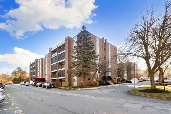 64 Main Street, Unit 53B Stoneham, MA 02180 - Photo 3 of 36 a city street lined with buildings and trees