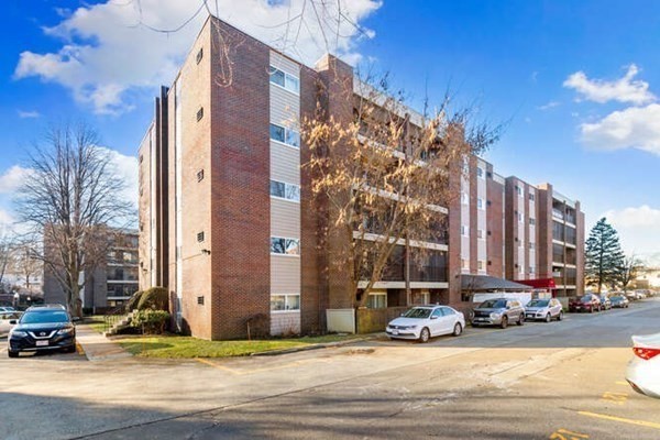 64 Main Street, Unit 53B Stoneham, MA 02180 - Photo 4 of 36 a view of a building and a street