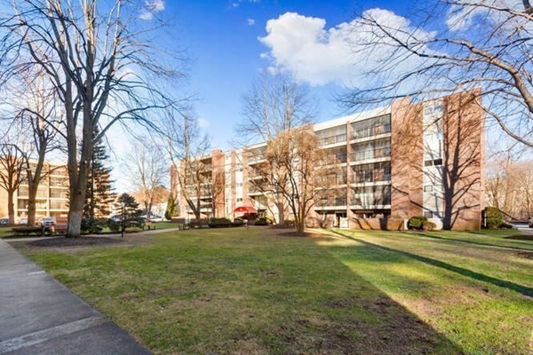 64 Main Street, Unit 53B Stoneham, MA 02180 - Photo 5 of 36 a view of building with yard