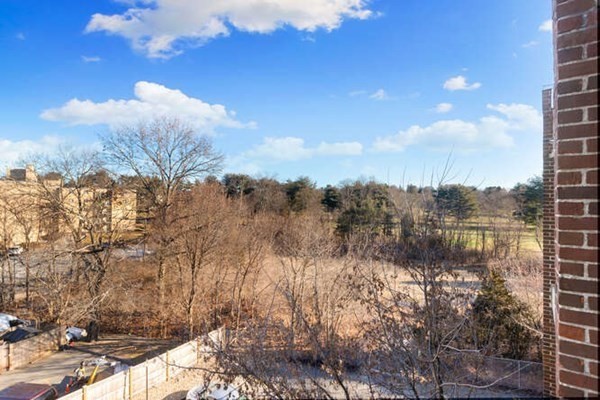 64 Main Street, Unit 53B Stoneham, MA 02180 - Photo 8 of 36 a view of lake with green space