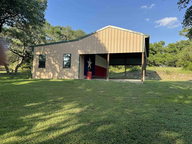 534 Scott's School Road Flatonia, TX 78941 - Photo 12 of 27 a view of a backyard with a garden and entertaining space