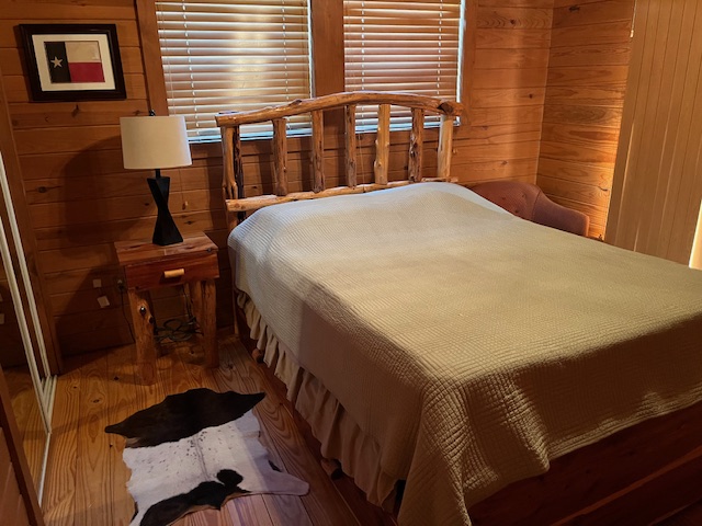 534 Scott's School Road Flatonia, TX 78941 - Photo 26 of 27 a bed sitting in a bedroom next to a window