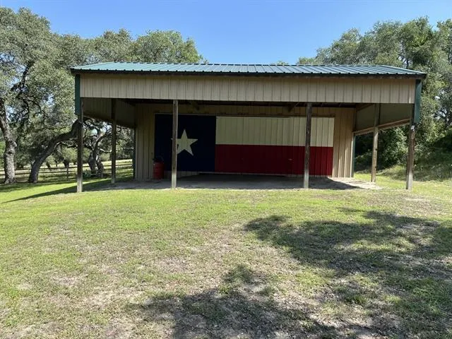 a view of a house with a yard and garage