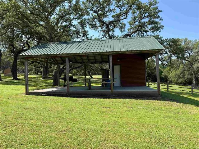 a view of outdoor space with trees all around